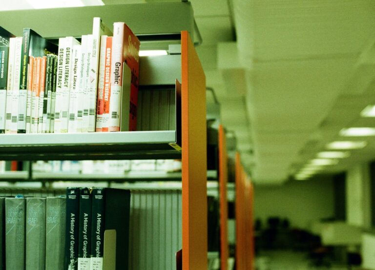 green tinged school library bookshelves image.jpg.optimal