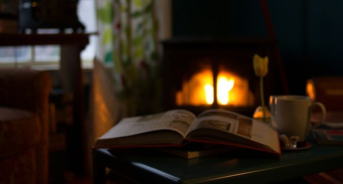 open book in front of fireplace.jpg.optimal